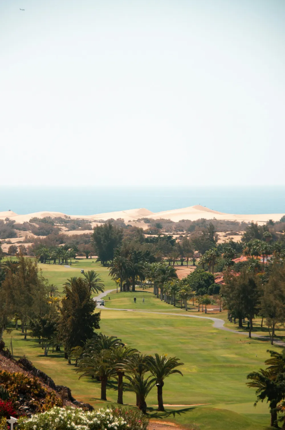 Golf course set among green hills