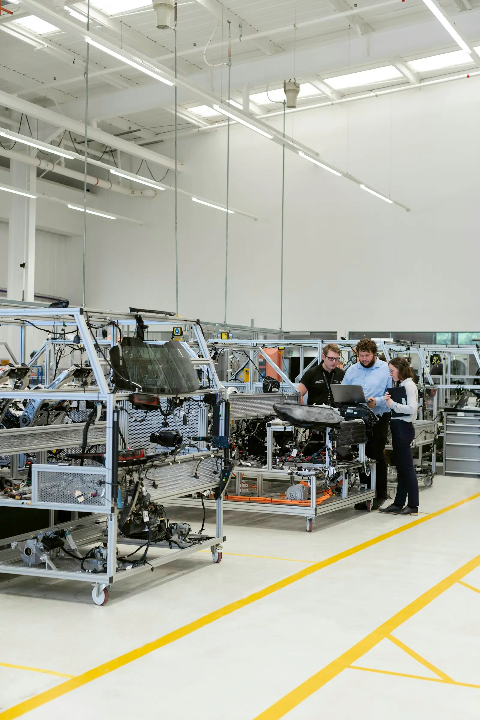 Engineers working inside an automotive factory